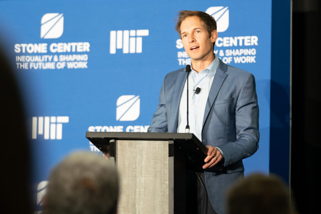 A man speaks from a podium.